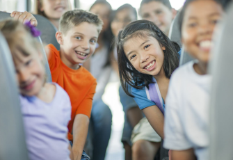 kids-on-school-bus-smiling